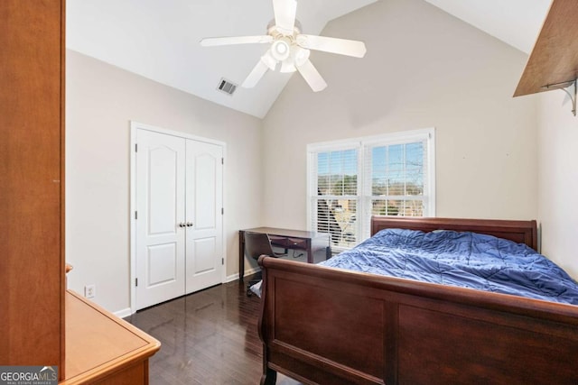 bedroom with ceiling fan, dark hardwood / wood-style flooring, high vaulted ceiling, and a closet