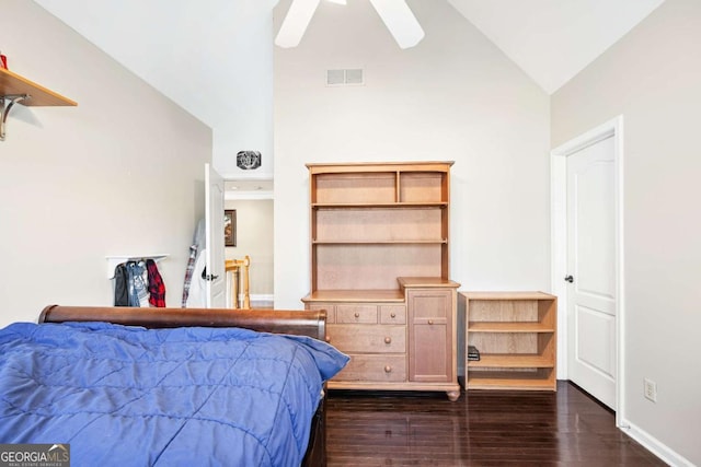 bedroom featuring ceiling fan, dark hardwood / wood-style floors, and vaulted ceiling