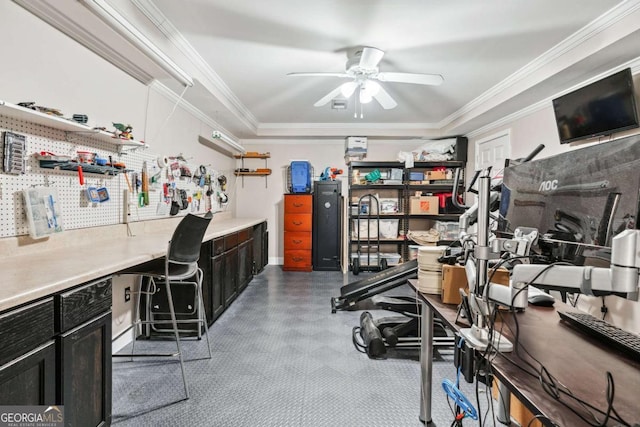 home office featuring crown molding, ceiling fan, and a workshop area