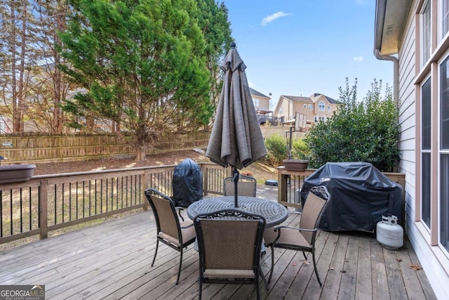 wooden terrace featuring area for grilling