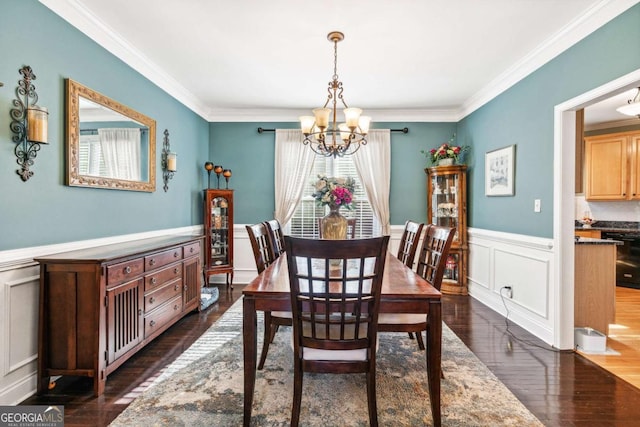 dining space with ornamental molding, dark hardwood / wood-style floors, and a notable chandelier