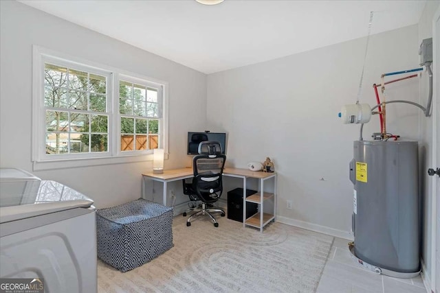 tiled home office featuring electric water heater and independent washer and dryer