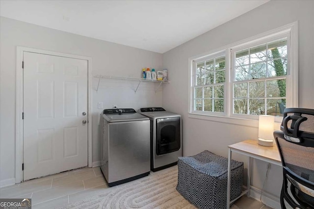 clothes washing area with washer and dryer