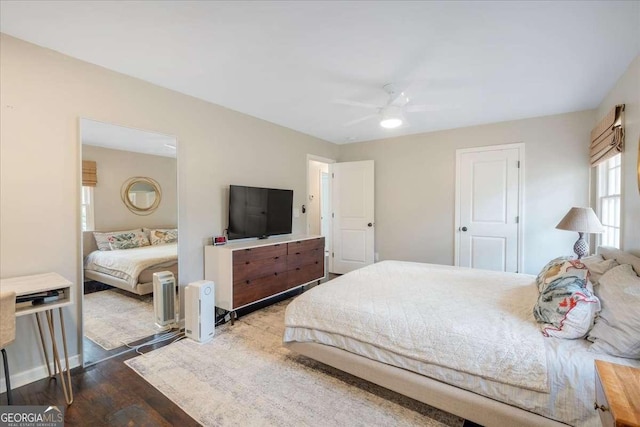 bedroom featuring dark wood-type flooring and ceiling fan