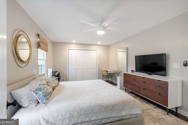 bedroom with ceiling fan and a closet