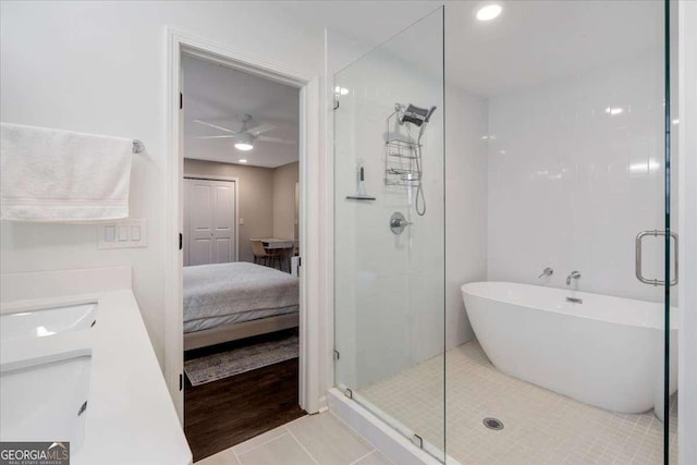 bathroom featuring sink, tile patterned floors, independent shower and bath, and ceiling fan