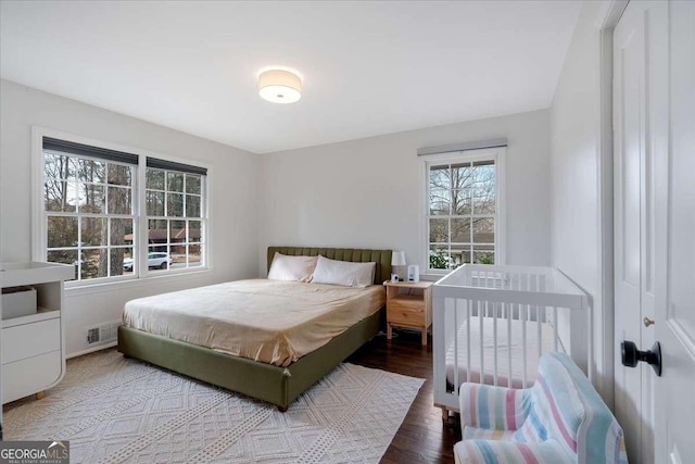 bedroom with wood-type flooring