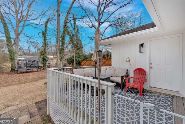 view of patio featuring outdoor lounge area and a trampoline