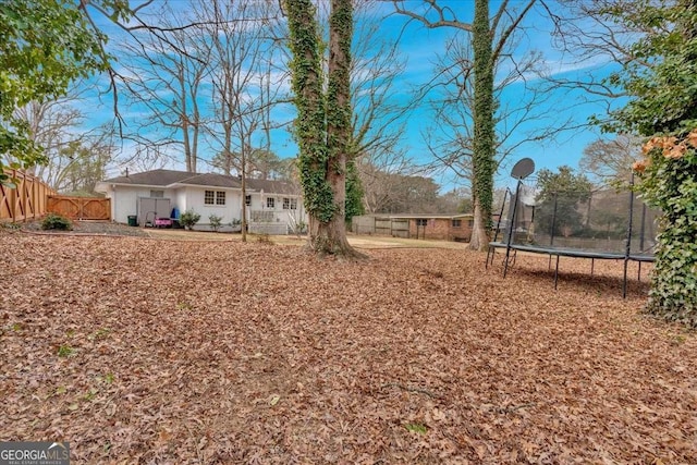 view of yard featuring a trampoline