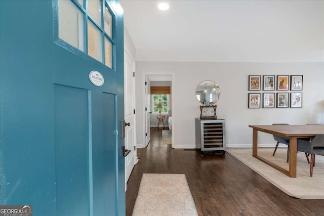 entryway featuring wine cooler and dark hardwood / wood-style flooring