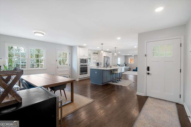 dining area with dark hardwood / wood-style floors