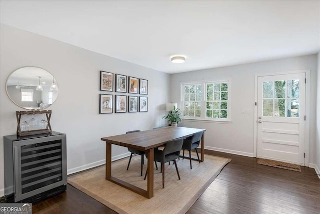 dining space with wine cooler and dark hardwood / wood-style flooring