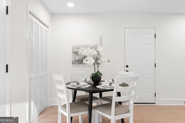 dining area featuring light wood-type flooring