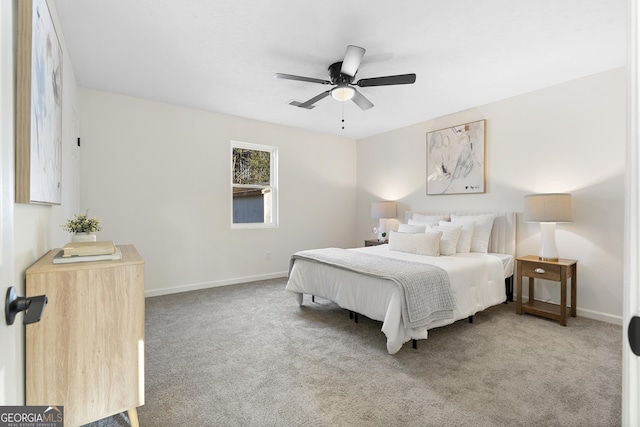 bedroom with ceiling fan and light colored carpet