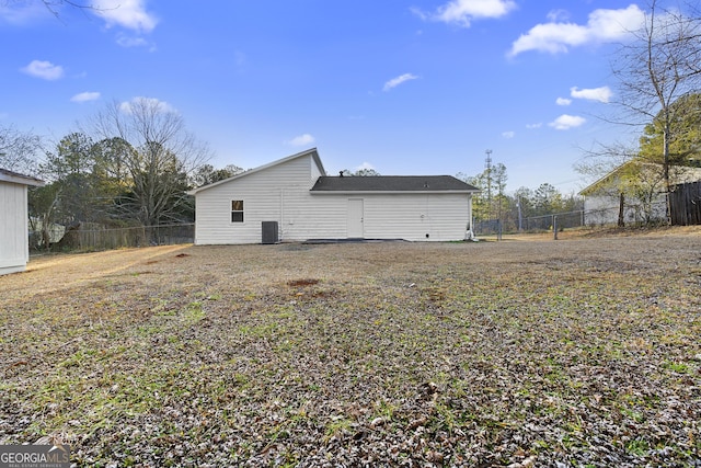 view of side of home with central AC unit