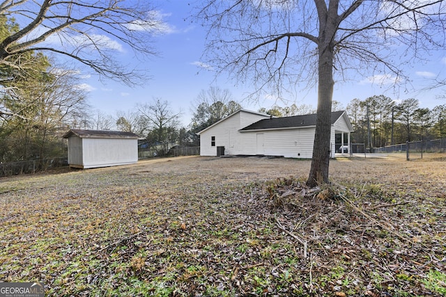 view of side of home with a storage unit