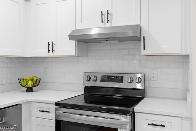 kitchen with white cabinetry, stainless steel electric stove, and light stone countertops