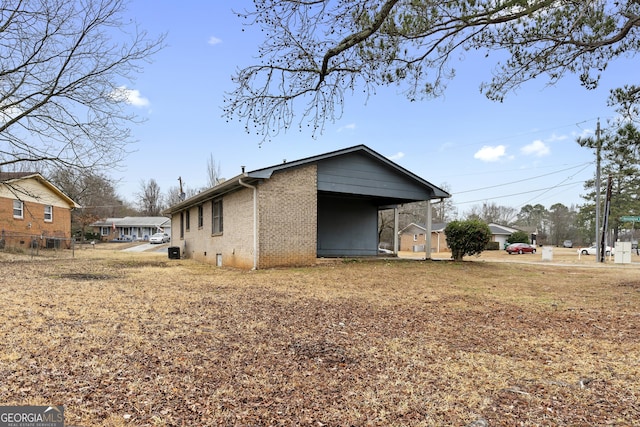 view of home's exterior with a carport