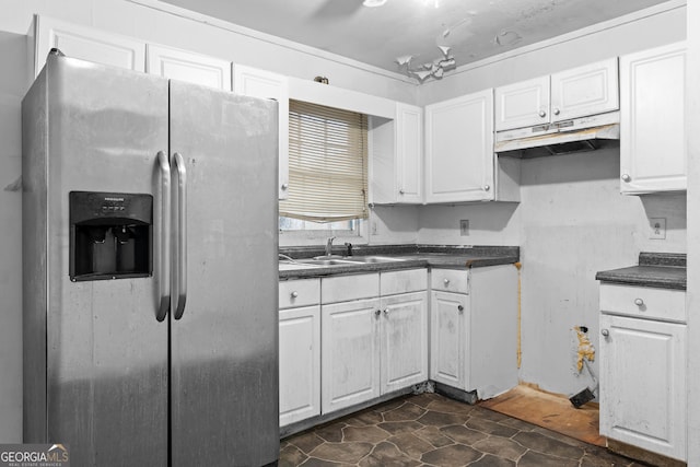 kitchen featuring white cabinetry, stainless steel refrigerator with ice dispenser, and sink