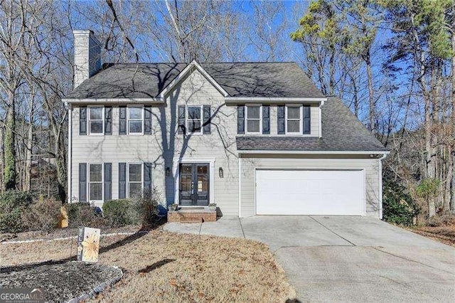 colonial home with a garage