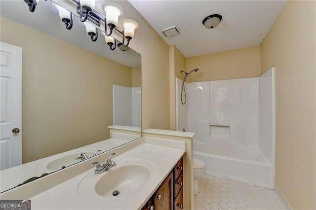 full bathroom featuring bathtub / shower combination, tile patterned floors, vanity, and toilet