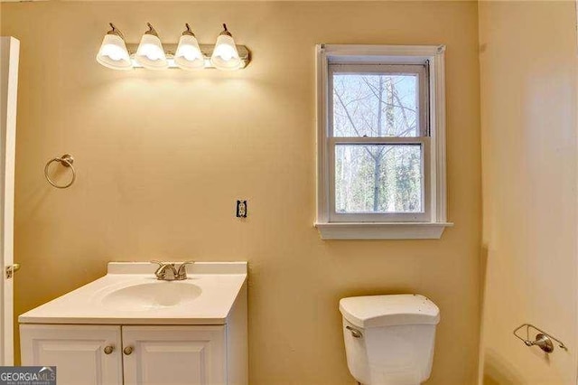 bathroom with vanity and toilet