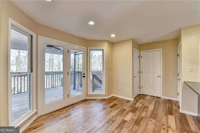 doorway to outside with light hardwood / wood-style floors