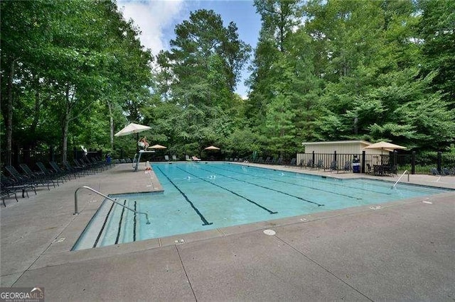 view of swimming pool featuring a patio