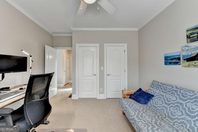 office space featuring crown molding, light colored carpet, and ceiling fan