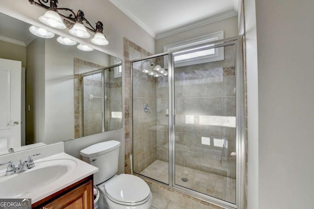 bathroom featuring vanity, crown molding, a shower with door, and toilet