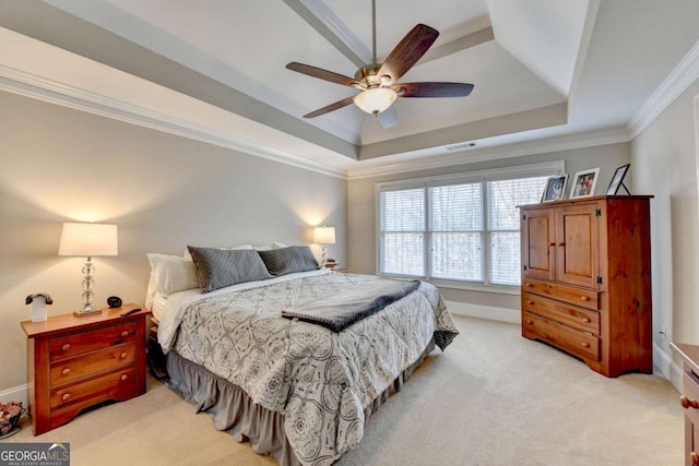 carpeted bedroom featuring crown molding, ceiling fan, and a raised ceiling