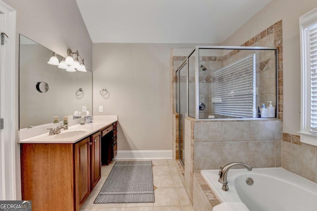 bathroom with tile patterned flooring, vanity, a wealth of natural light, and plus walk in shower