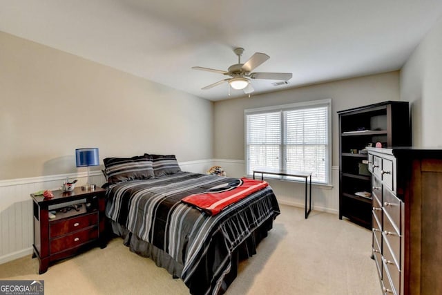 bedroom with light carpet and ceiling fan