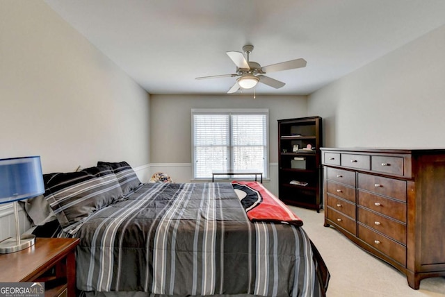 bedroom featuring ceiling fan and light colored carpet