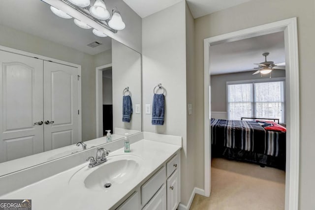 bathroom featuring vanity and ceiling fan