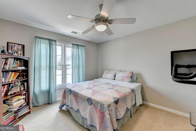 carpeted bedroom with ceiling fan