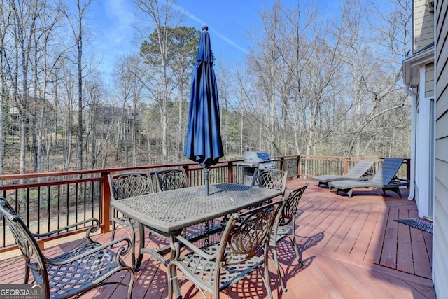 wooden deck featuring area for grilling