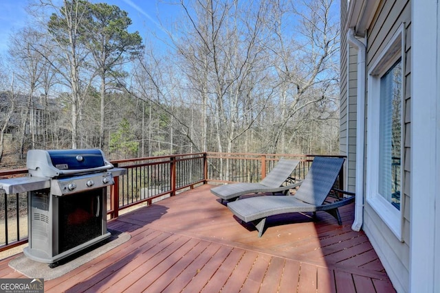 wooden deck with grilling area