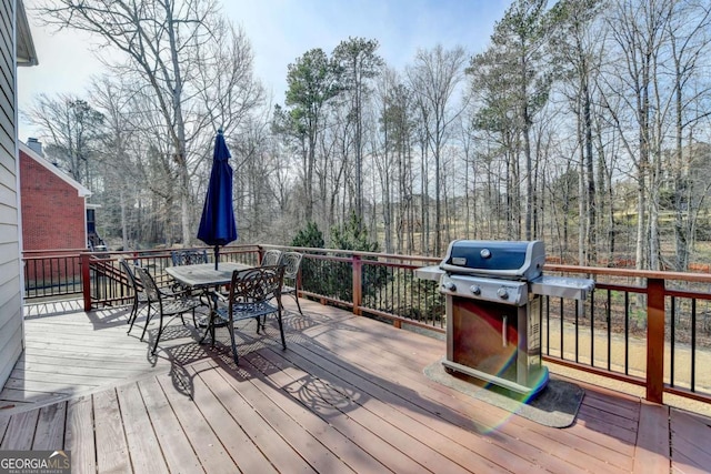 wooden deck featuring grilling area