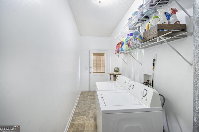 washroom featuring washing machine and dryer