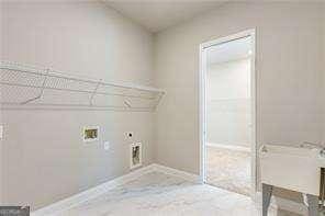 laundry room with electric dryer hookup, baseboards, laundry area, and washer hookup