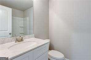 bathroom with vanity and toilet