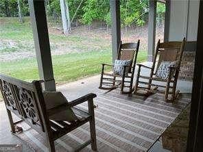 wooden terrace with a yard