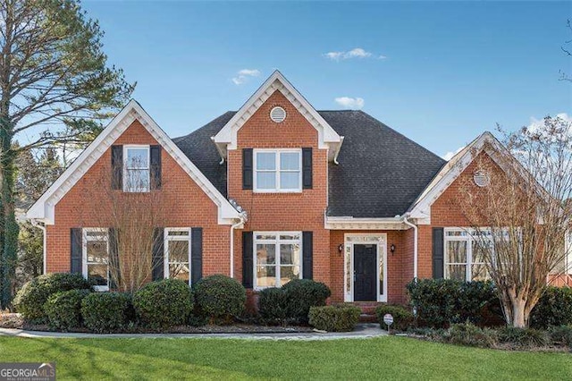 view of front of home with a front yard