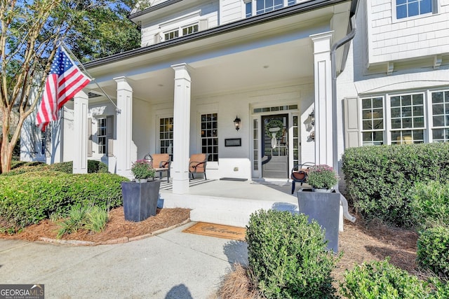 property entrance featuring a porch