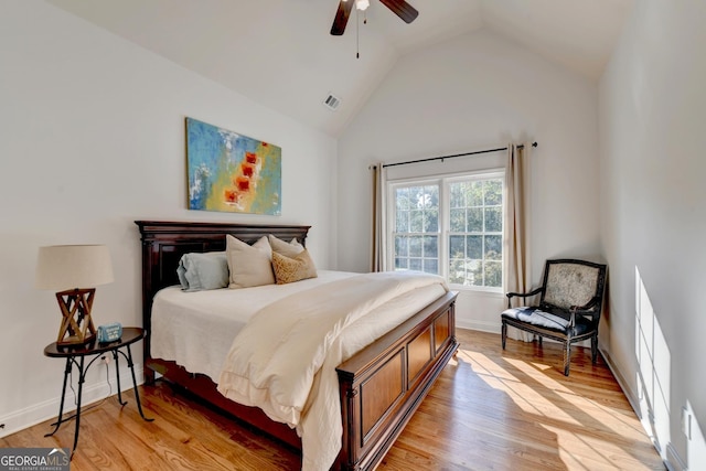 bedroom featuring lofted ceiling, hardwood / wood-style floors, and ceiling fan