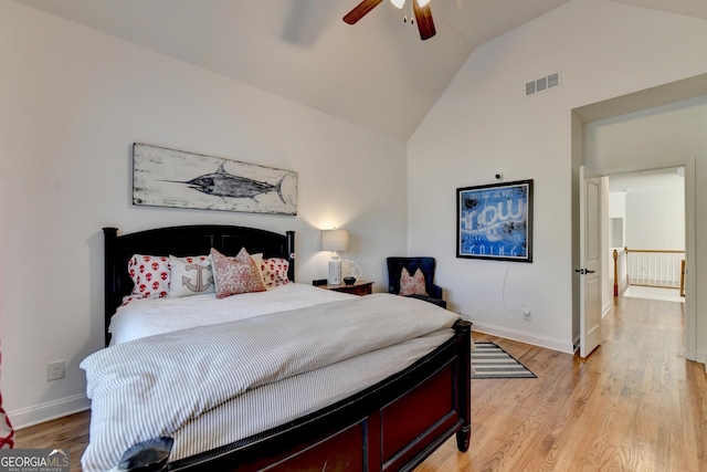 bedroom with vaulted ceiling, ceiling fan, and light hardwood / wood-style floors