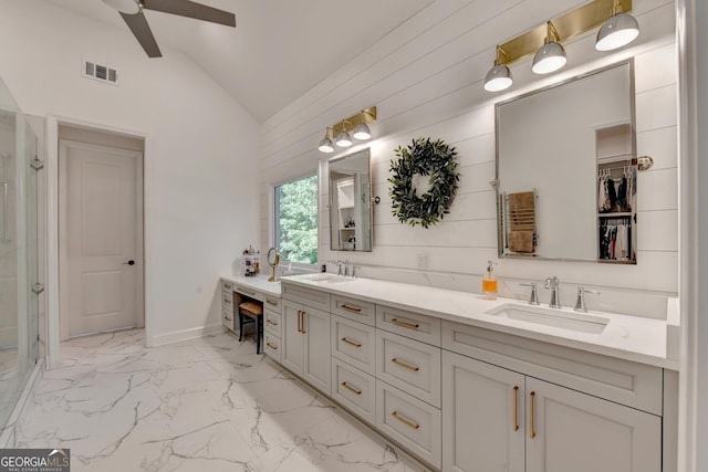 bathroom with lofted ceiling, vanity, and ceiling fan