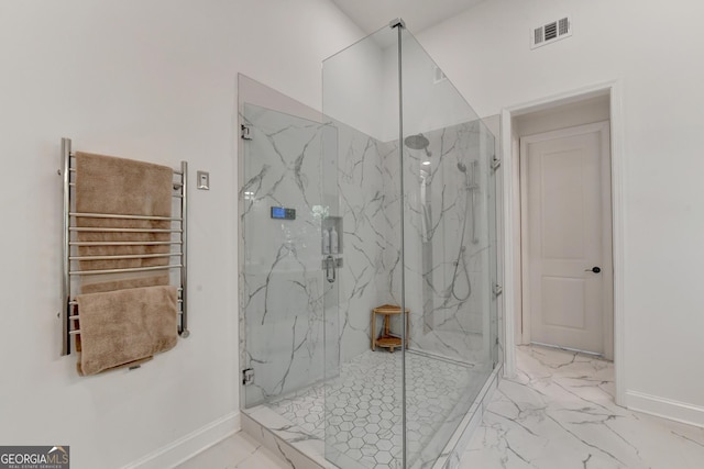 bathroom with an enclosed shower and radiator