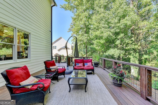 wooden terrace featuring an outdoor living space